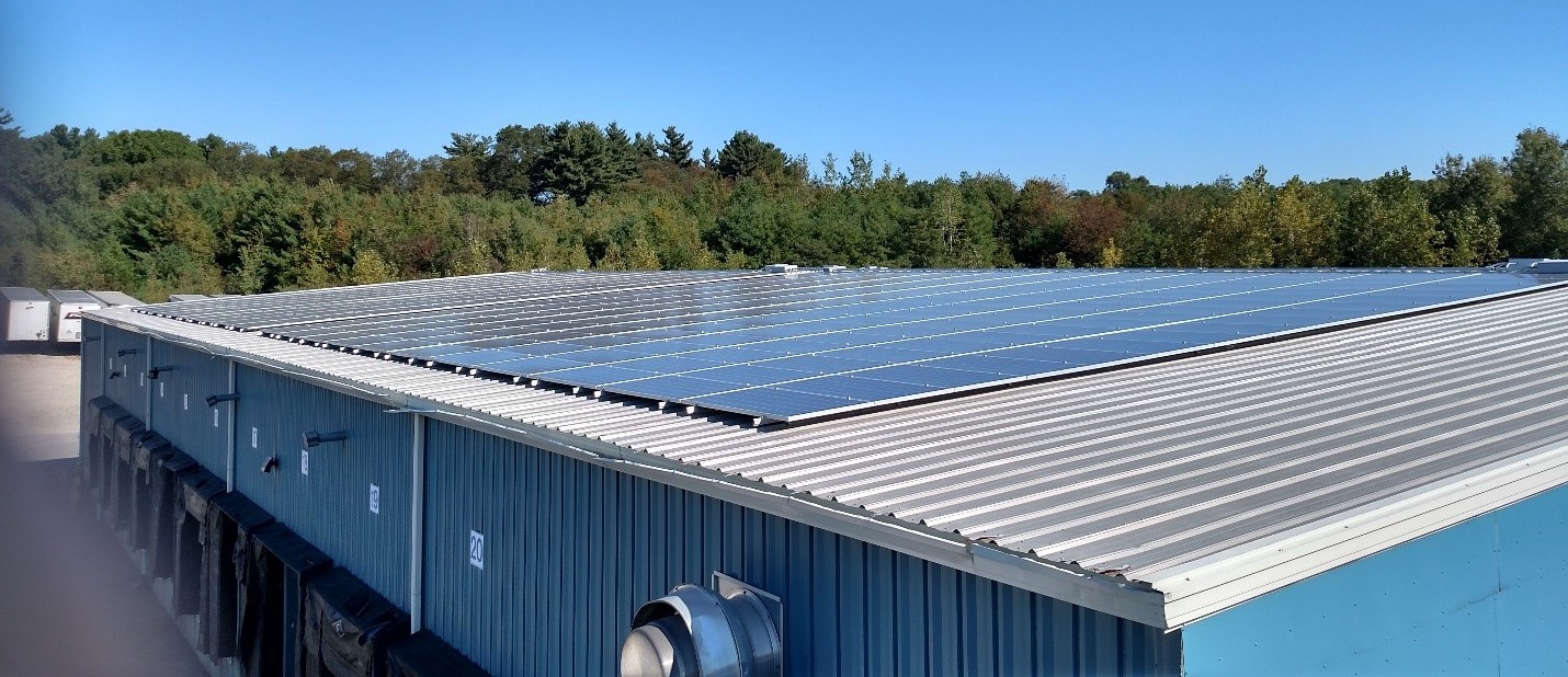 Photograph taken by William Borek, Operations Director of Braun’s Express. The photo shows half of the newly installed solar panels on the rear portion of roof on the warehouse of the Braun’s Express terminal in Hopedale, MA. 